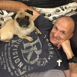 Relaxed cat and dog at home being cared for